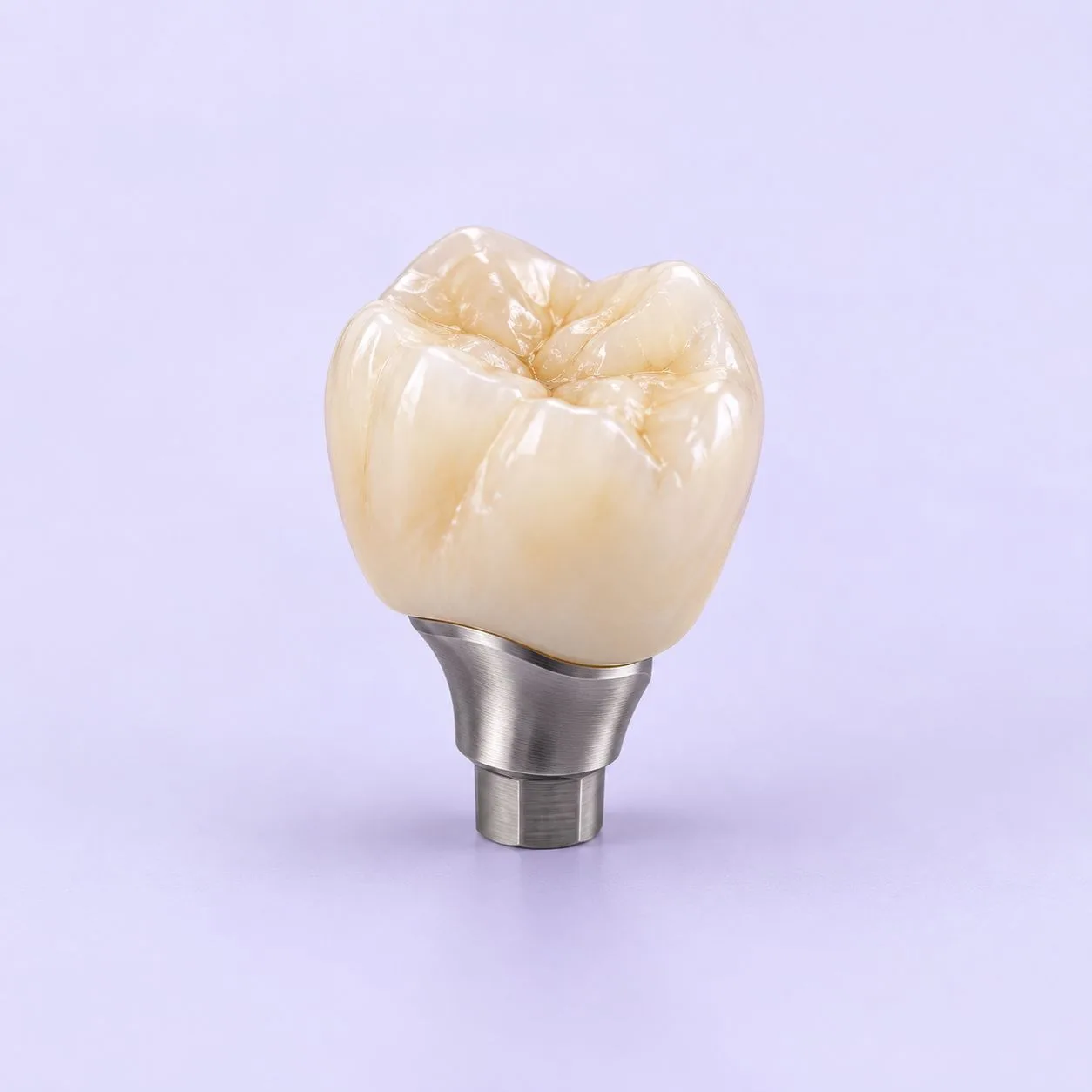An Atlantis crown on its patient-specific abutment, photographed from the side against a plain ground